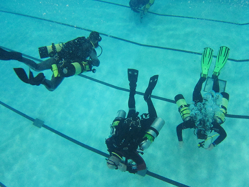 Sidemount diving involves carrying cylinders along the side instead of the back.
